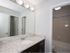 Bathroom with white granite countertops