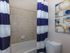 bathroom with standard tub