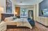 Spacious bedroom large enough to fit a king size bed with luxurious carpet beautiful natural light.