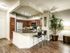 Beautiful kitchen featuring an island, stainless steel appliances, tile back splash and granite counter tops.