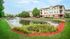 Exterior of building with pond feature in foreground