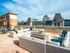 Rooftop Fireplace and Grilling Area surrounded by lounge furniture.