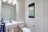 Bathroom, large mirror and pendant lighting.