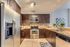 STUNNING OPEN KITCHEN, GRANITE COUNTER TOPS IN SELECT UNITS,GE ENERGY STAR STAINLESS STEEL APPLIANCES.