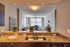 STUNNING OPEN KITCHEN, GRANITE COUNTERTOPS IN SELECT UNITS,GE ENERGY STAR STAINLESS STEEL APPLIANCES.