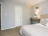 Bedroom with plush carpeting