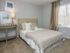 Bedroom with plush carpeting