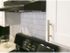 White shaker style kitchen cabinet with stainless pulls and subway tile backsplash