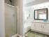 Large bathroom with shaker style cabinets, garden tub and separate stand up shower