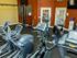 fitness center with stationary bikes and elliptical machines