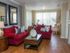 model home living room with large couches and coffee table