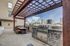 Outdoor grilling space, dinning room table with a view of downtown Dallas.