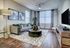 Spacious open living room, hardwood floors, large windows and natural light