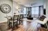 Spacious open living room, hardwood floors, large windows and natural light
