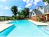 Sparkling Pool with loungers and tables for socializing
