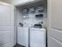 Treviso Grand Apartments - North Venice, Florida laundry closet with full size set and shelving