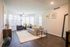 Beautiful furnished model living room with wood inspired plank flooring