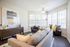 Beautiful furnished model living room with wood inspired plank flooring