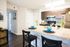 Modern Kitchen with Granite Style Countertops and Wood Inspired Flooring