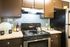 Modern Kitchen with Granite Style Countertops and Stainless Appliances