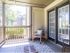 Large enclosed outdoor patio attached to apartment home