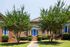 Exterior entryways with blue doors surrounded by trees
