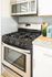 Modern kitchen with white cabinets, subway tile backsplash, and granite countertops