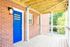 Exterior entryway with deck and beautiful blue door