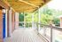 Exterior entryway with deck and beautiful blue door