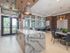Ridgelake, interior, common room, dining area, tables, chairs, large windows,