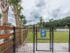 Ridgelake, exterior, dog park, large dog sign, palm trees