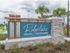 Ridgelake, exterior, blue property sign, landscaping, palm trees
