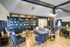 The Henry Apartments, interior, clubhouse, spacious seating areas,tables and chairs, book shelves