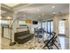 The Henry Apartments, interior, spacious room, seating, large windows, door to deck,