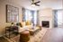 Living Room with Fireplace, ceiling fan with a light and faux wood flooring