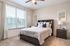 San Mateo Apartments Kissimmee Florida bedroom with carpeted floors and ceiling fan