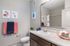 San Mateo Apartments Kissimmee Florida bathroom with framed mirror