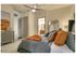 Spacious bedroom large enough to fit a king size bed with luxurious carpet beautiful natural light.