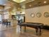 Residents Playing Billiards | The Parkways at Prairie Creek Apartments