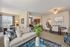 Open concept modern kitchen, dining and living area