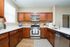 Open concept modern kitchen with quartz countertops and stainless steel appliances