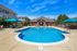 Outdoor swimming pool with lounge chairs
