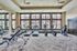 Fitness center with strength training and smart technology cardio machines, three treadmills, two elliptical and one bike