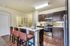 Beautiful open kitchen. Custom kitchen Cabinets, designer tile backsplash Stainless steel GE appliance package, Premium quartz countertops