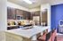 Beautiful open kitchen. Espresso kitchen Cabinets, designer tile backsplash Stainless steel GE appliance package, Premium quartz counter tops