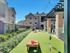 outdoor game court yard, with mini golf and corn hole.