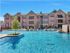 Beautiful Luxury pool with lounge chairs. Beautiful fountains falling into the pool and a small courtyard.