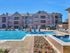 Beautiful Luxury pool with lounge chairs. Beautiful fountains falling into the pool.