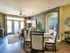 Open concept floor plan, with natural light. Ceiling fan and faux wood flooring. Spacious dinning room open to living room. Large windows with natural light!