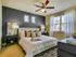 Spacious bedroom large enough to fit a king size bed with soft clean carpet and modern ceiling fan, beautiful natural light.